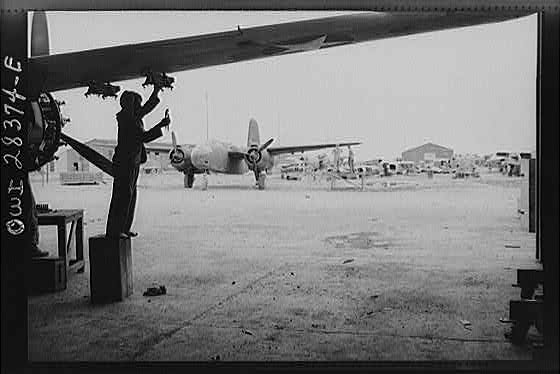 Iranian mechanic working on an American warplane about to be turned over to the Russians at a point of delivery somewhere in Iran.