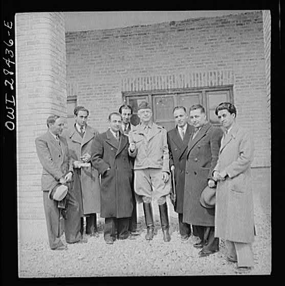Major General Donald H. Connolly, the Commander of the United States Army Forces in Iran and Iraq, taking a group of Iranian journalists on a tour of United States Army installations. The journalists were guests at the soldiers' mess and were shown that only American food was served, thus not depriving the Iranians of their own food supply