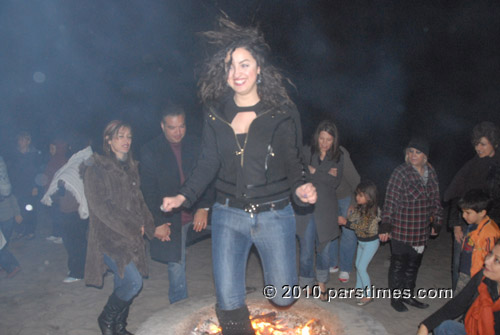 Woman jumping over fire (March 15, 2011) - by QH