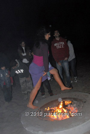 Woman jumping over fire (March 15, 2011) - by QH