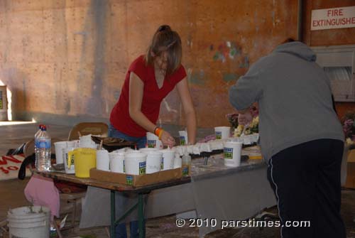 A volunteer working on Decorations - Pasadena (December 31, 2010) - by QH