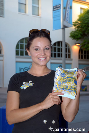 Woman giving away free Pop Secret Popcorn - by QH