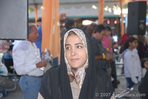 Woman watching the Kurdish Dance - by QH