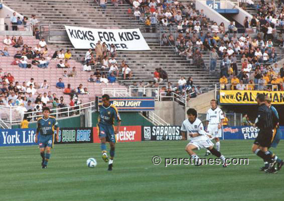 Khodadad Azizi playing at the Rose Bowl - by QH