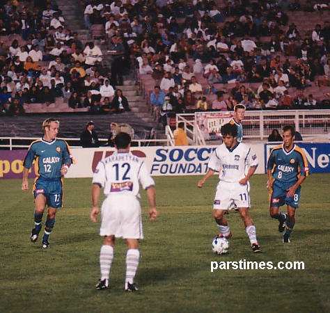 Khodadad Azizi playing at the Rose Bowl - by QH