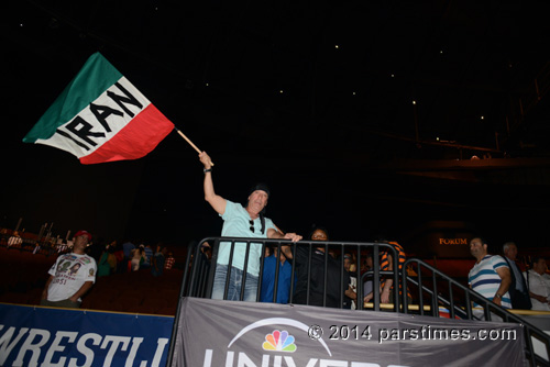 Fan cheering the Iranian wrestling team