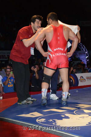 Reza Yazdani talks to Iran's coach Rasool Khadem